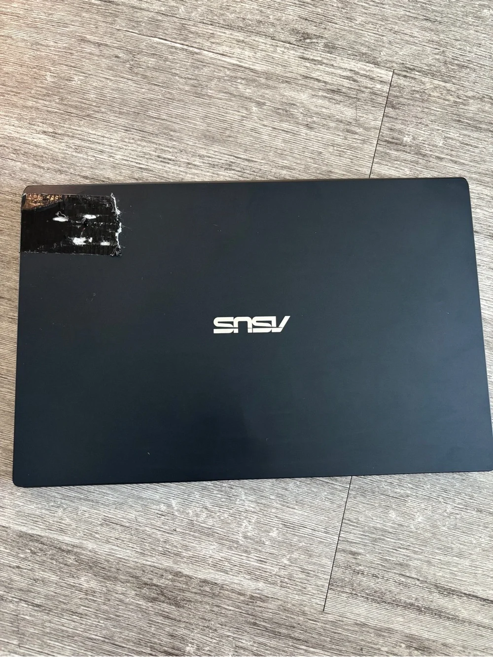 ASUS Matte Black Laptop with Highlighted Enter Key
